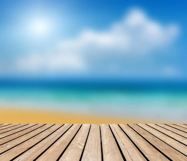 Empty wooden table and beach blurred background — Stock Photo, Image