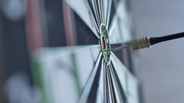 Dart hitting bulls eye, bulls-eye three shots . Concept of successful business ideas hitting the exact center of the target. Perfect performance of the task and superiority over the rivals.