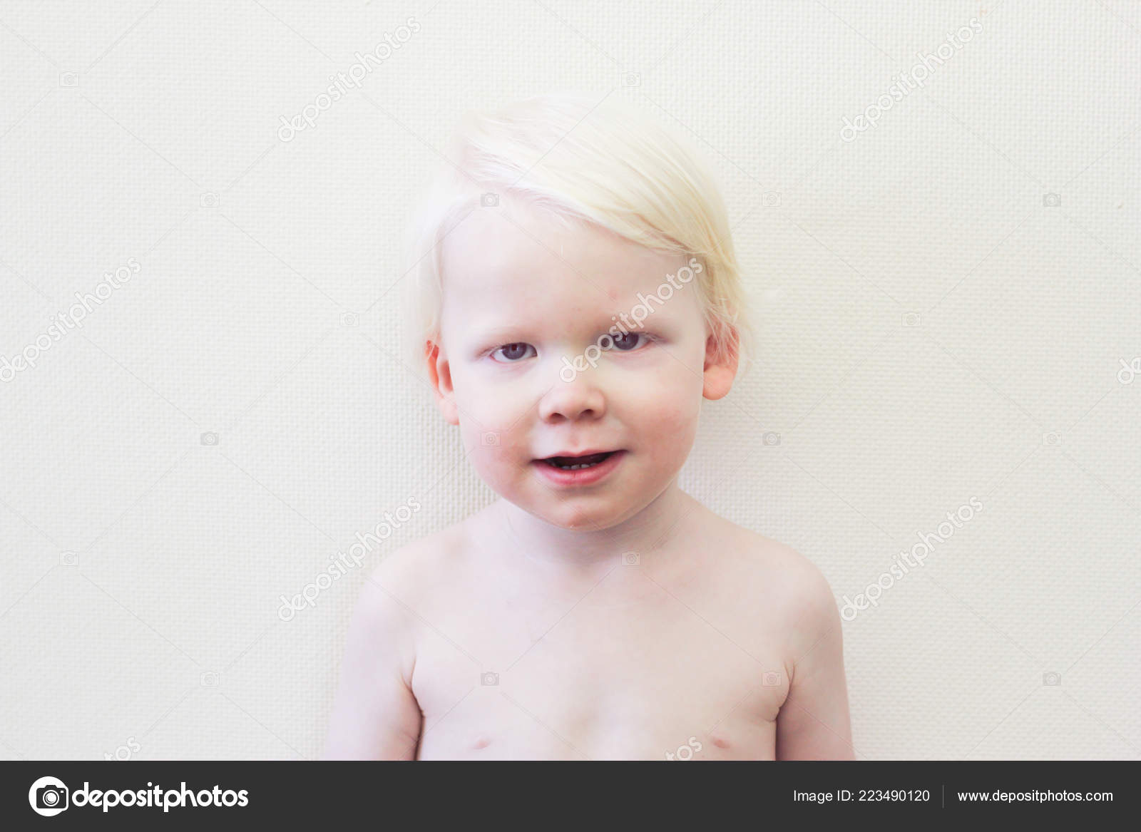 Whitehair babyboy with albinism syndrome on white Stock Photo by ©Iraidka  223490120