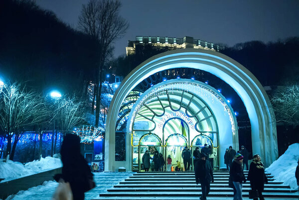 Kyiv, Ukraine - Jan 8, 2017: Funicular railway in night winter. Earth covers the snow after Christmas The bottom station of the Kyiv funicular has access to the upper Vladimir's Hill. Selective focus, long exposure, movement
