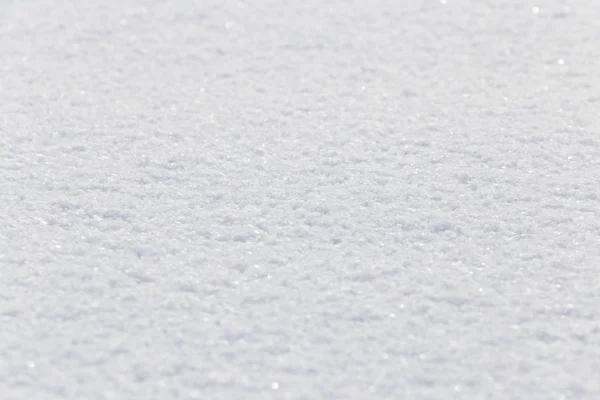 Hintergrund des weißen flauschigen Schnees — Stockfoto