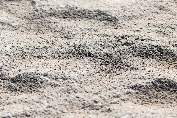 Фон из песка на берегу — стоковое фото