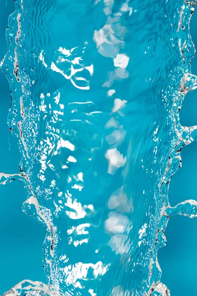 Water splash on blue background — Stock Photo, Image