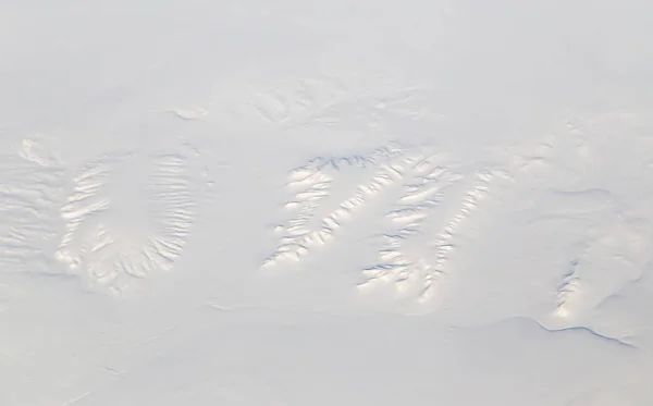 Tierra nevada. vista desde el avión —  Fotos de Stock