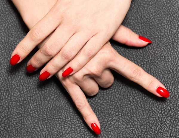 Hand with red nail polish. rock — Stock Photo, Image