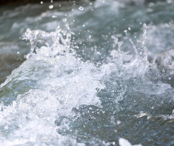 Stormy water wave as a background — стоковое фото