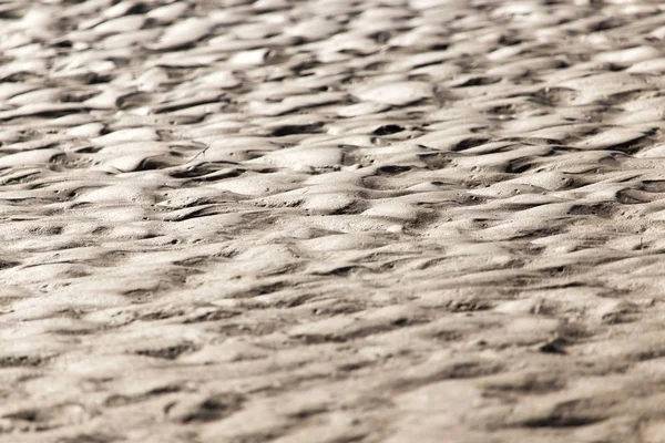 Фон из песка на берегу — стоковое фото
