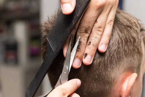 Mens hair cutting scissors in a beauty salon — Stock Photo, Image