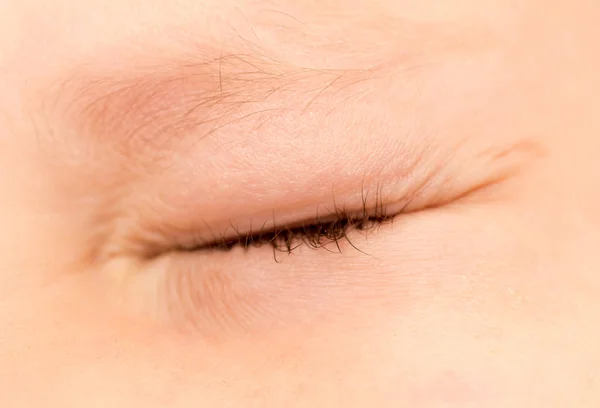 An indoor childrens eyes. close — Stock Photo, Image