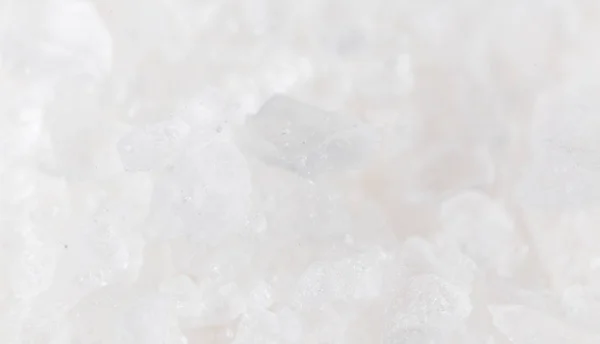 Weißes Salz als Hintergrund. Makro — Stockfoto