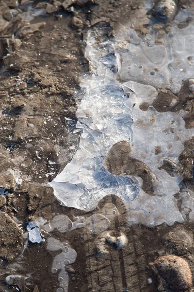 Winter ice on the ground as a background — Stock Photo, Image