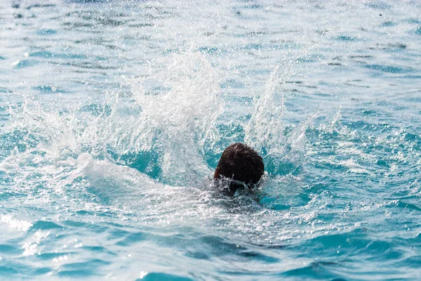 The boy is swimming in the pool — Stock Photo, Image