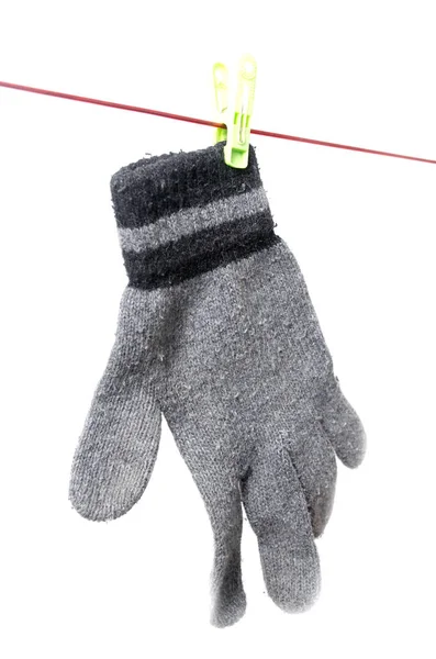 Glove on a rope on a white background — Stock Photo, Image