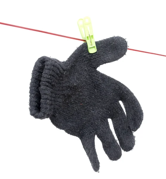 Glove on a rope on a white background — Stock Photo, Image