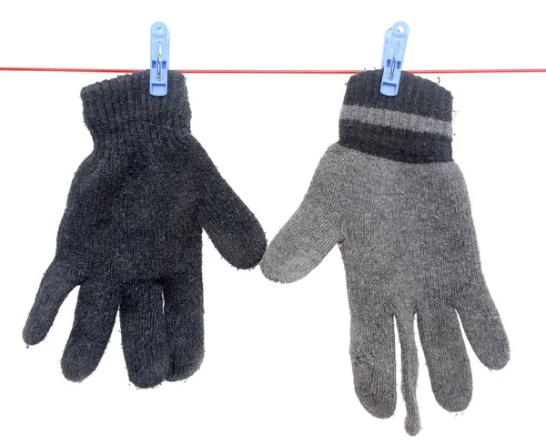 Handschuh am Seil auf weißem Hintergrund — Stockfoto