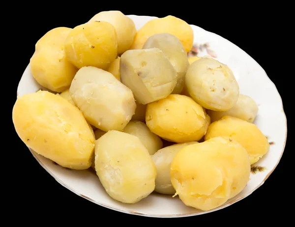 Gekookte aardappelen op een zwarte achtergrond — Stockfoto