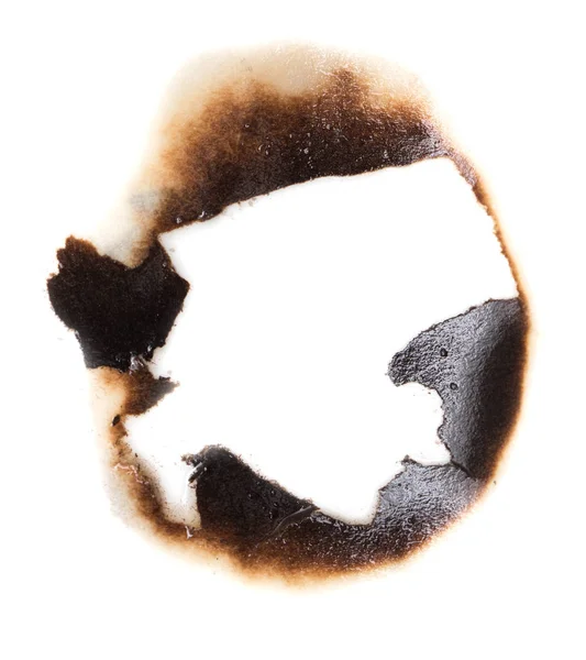 Verbrande gat in een papier — Stockfoto