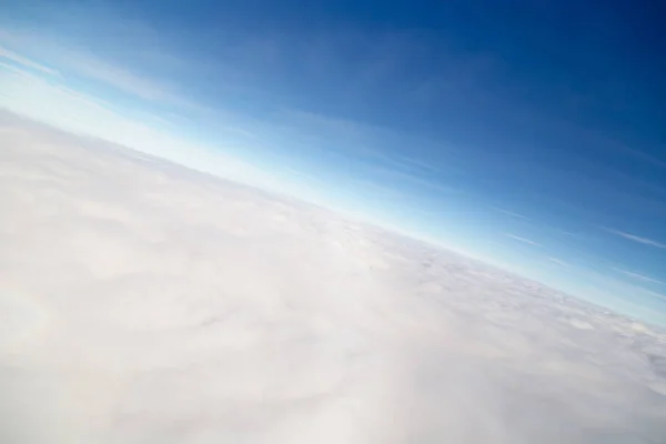 Blue sky high view from airplane clouds shapes — Stock Photo, Image