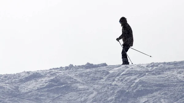 Athlete skiing in the snowy mountains