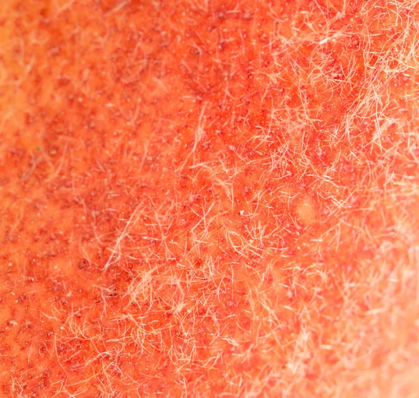 The skin of the peach as a background. close — Stock Photo, Image