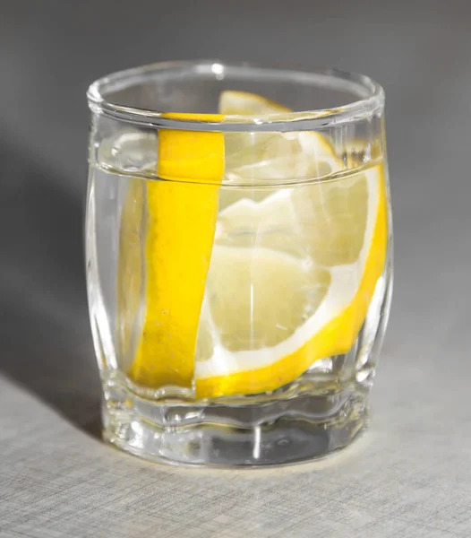 Lemon in a glass of vodka — Stock Photo, Image