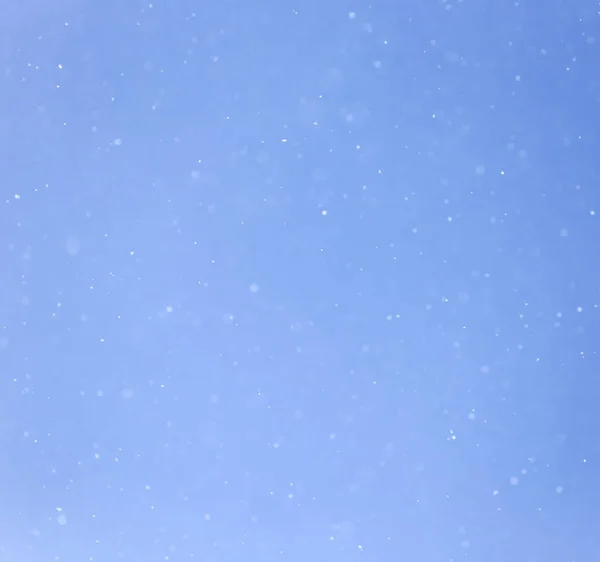Snow in blue sky — Stock Photo, Image
