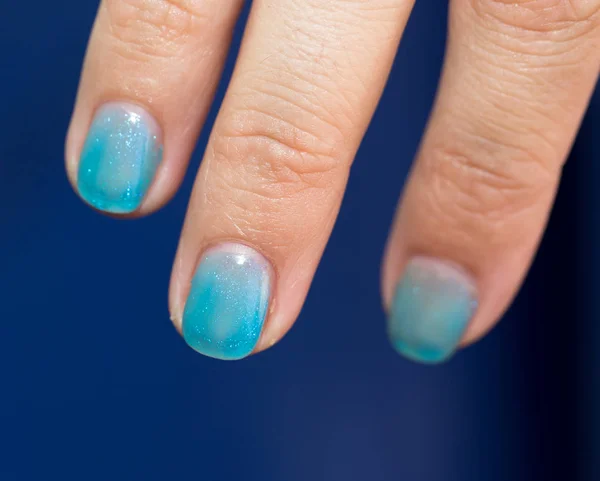 Nail polish on their fingers — Stock Photo, Image