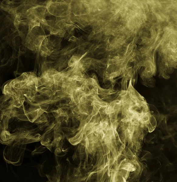 Yellow smoke against a black background — Stock Photo, Image