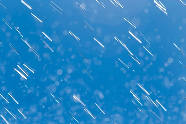 Rain drops on a background of blue sky — Stock Photo, Image