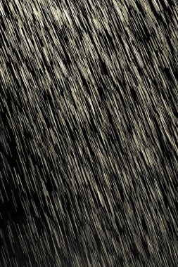 siyah bir zemin üzerine sarı yağmur