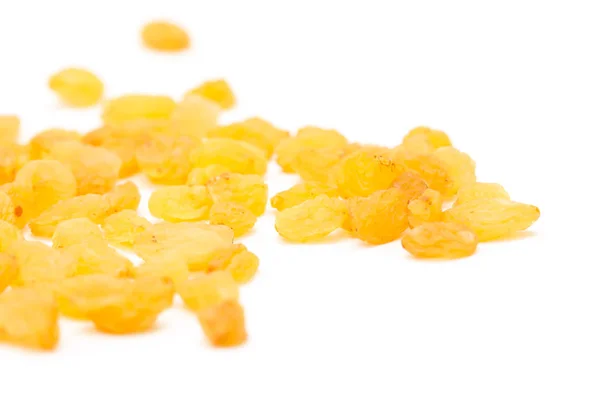 Golden raisins on a white background — Stock Photo, Image