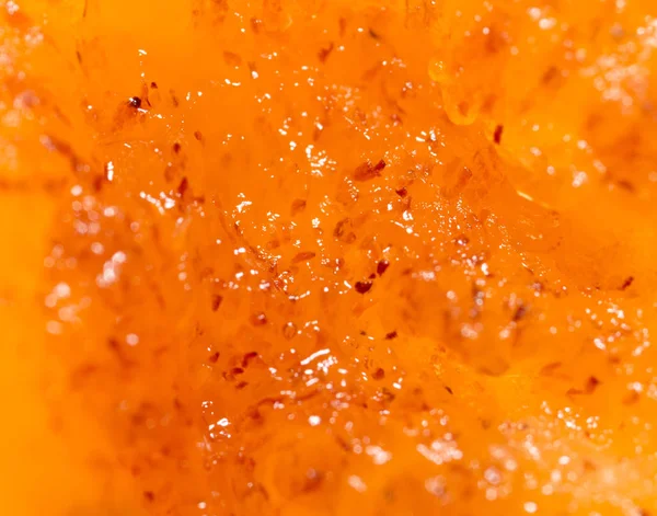 Pulp rijpe persimmons als achtergrond. Macro — Stockfoto