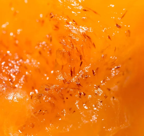 Dužina zralé persimmony jako pozadí. makro — Stock fotografie