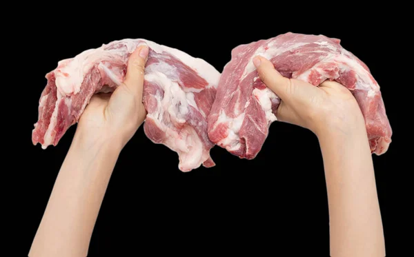 Färskt kött i handen på svart bakgrund — Stockfoto