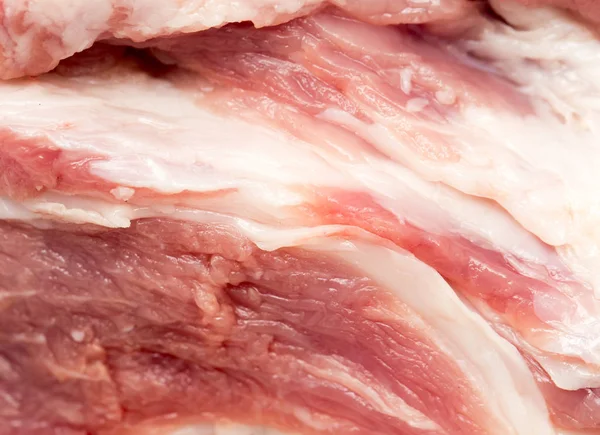 Frisches Schweinefleisch als Hintergrund — Stockfoto