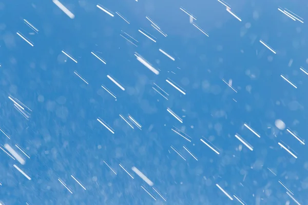 Rain drops on a background of blue sky — Stock Photo, Image