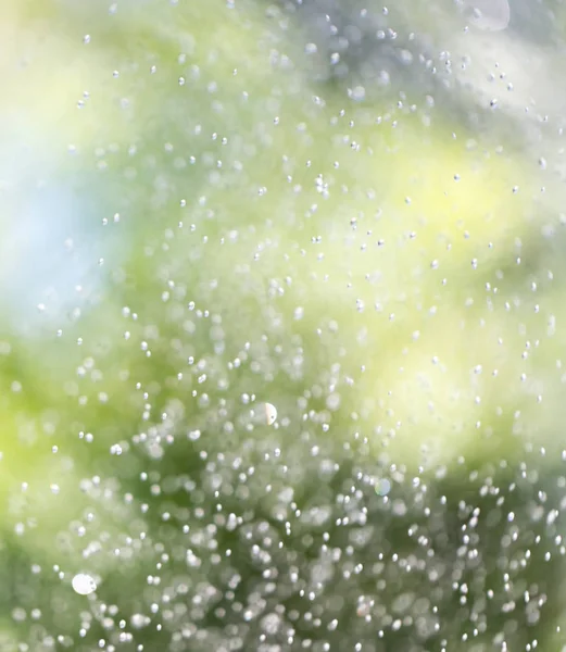 Salpicando agua en la naturaleza. antecedentes — Foto de Stock