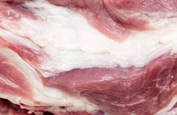 Mięso wieprzowe świeże jako tło — Zdjęcie stockowe