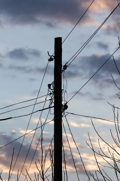 Electric pole på sunrise sun — Stockfoto