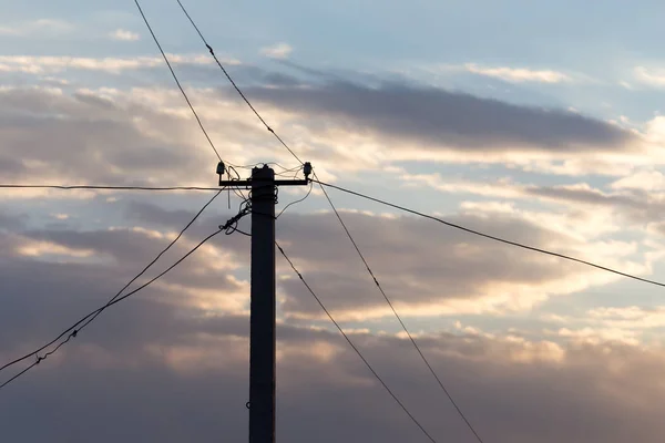Electric pole på sunrise sun — Stockfoto