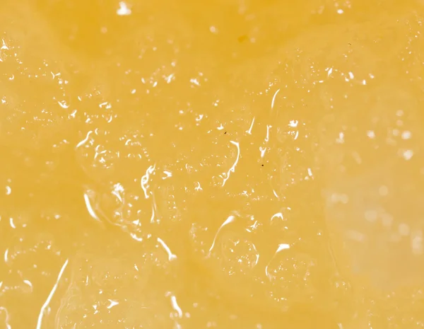 Yellow delicious honey as background — Stock Photo, Image