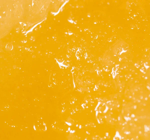 Yellow delicious honey as background — Stock Photo, Image