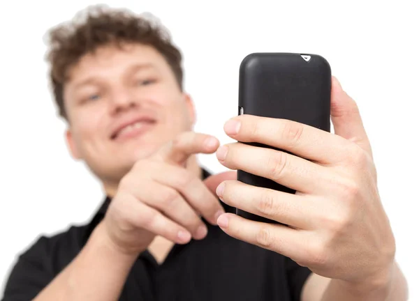 Homem com telefone em um fundo branco — Fotografia de Stock