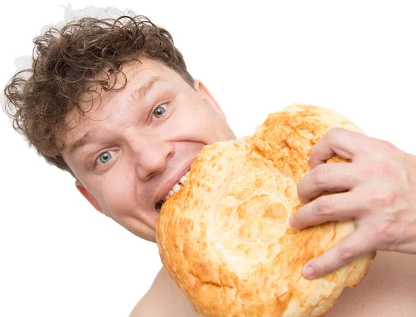 男は、白い背景の上のパンを食べる — ストック写真