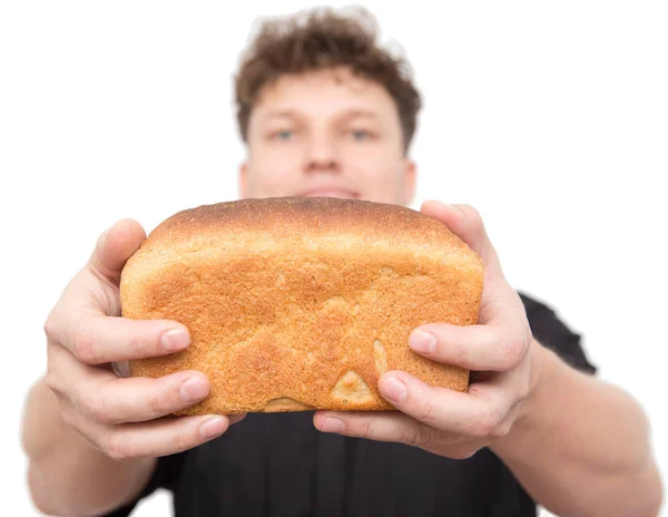 Человек с хлебом на белом фоне — стоковое фото