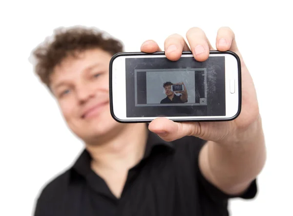 Человек с телефоном на белом фоне — стоковое фото
