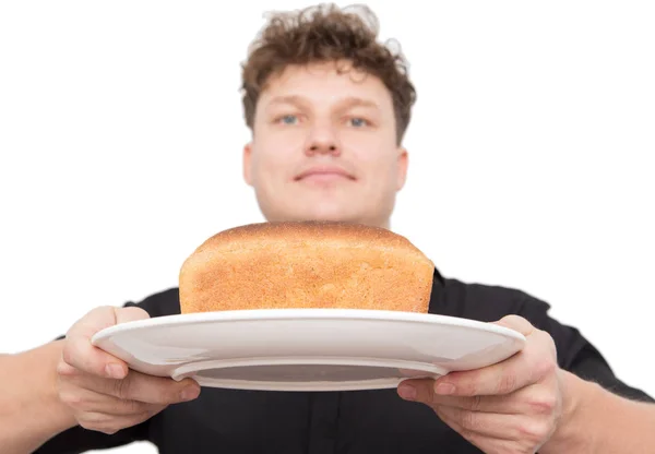 Mannen med bröd på en vit bakgrund — Stockfoto