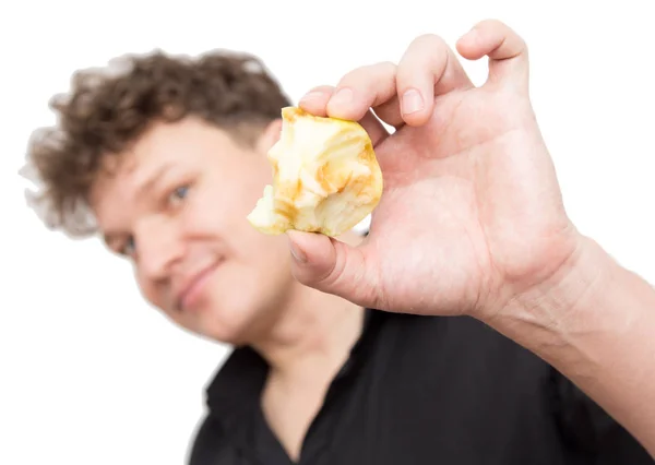 Een man het eten van een appel op een witte achtergrond — Stockfoto