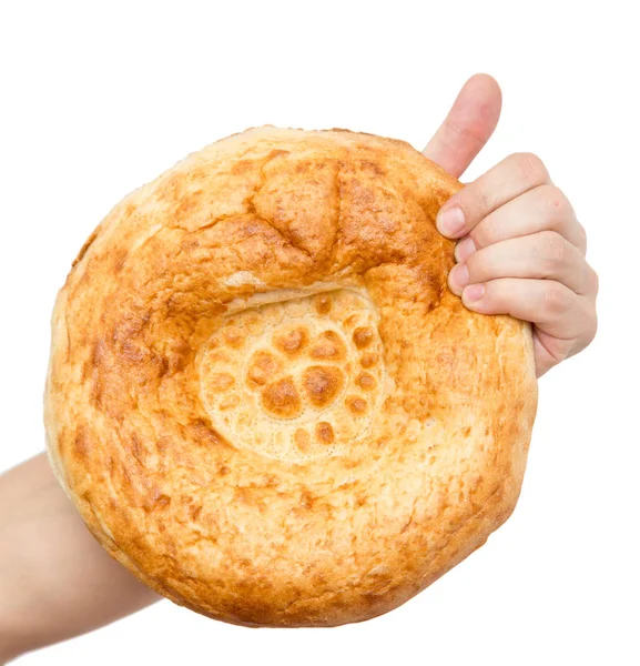 Beyaz bir arka plan üzerinde elinde taze ekmek — Stok fotoğraf