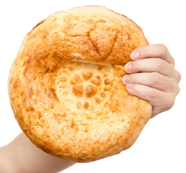 Fresh bread in his hand on a white background — Stock Photo, Image